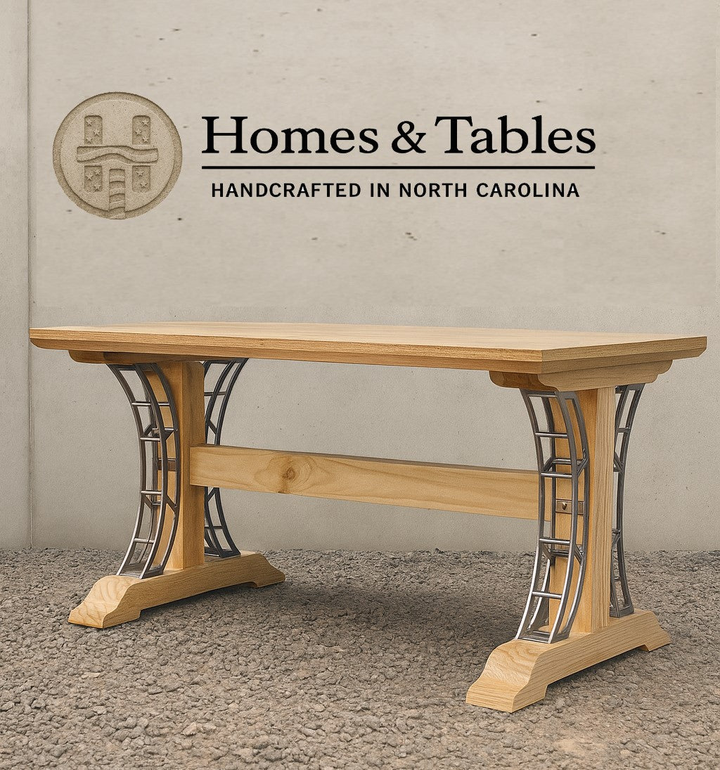 Wooden table with metal legs on a textured surface, branded 'Homes & Tables'.